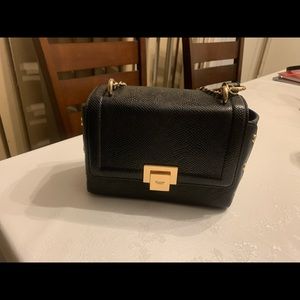 Very stylish classy black bag.